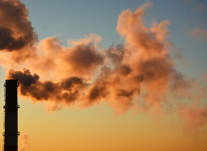Factory chimney emitting clouds of smoke
